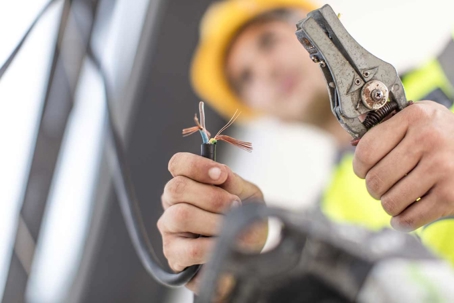 electrician stripping a wire
